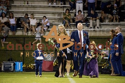 Homecoming walking across the field 